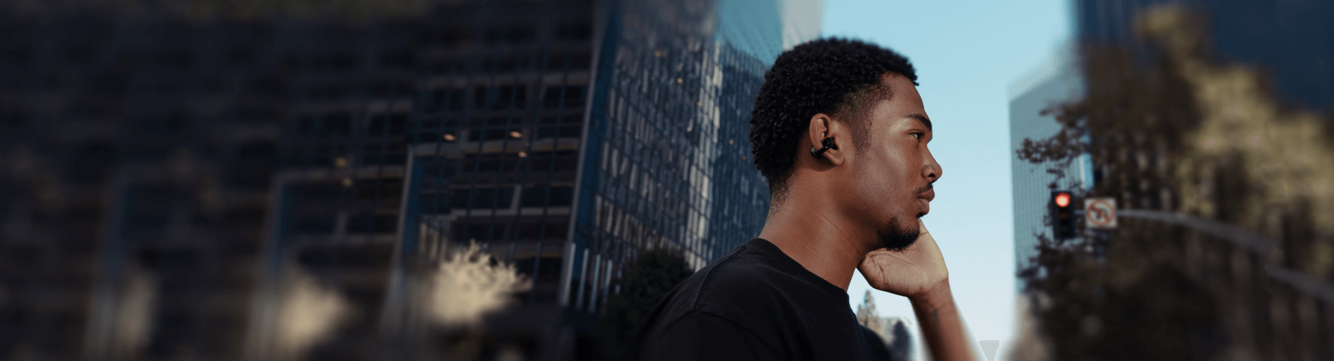 a young man wear comfo c earbuds