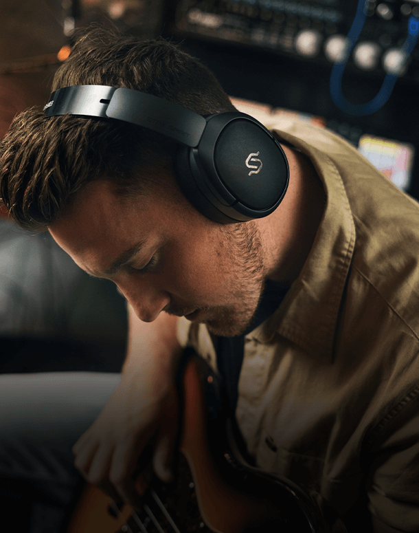 a man wears black wh950nb headphones